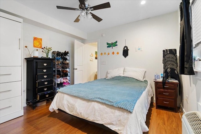 306 E 30th St Unit 102, Austin, TX 78705 - bedroom with wood finished floors, recessed lighting, and ceiling fan