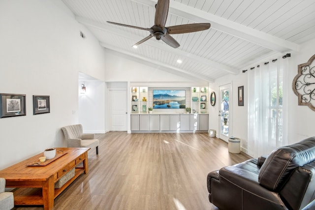 living room featuring ceiling fan, beamed ceiling, high vaulted ceiling, hardwood / wood-style floors, and wood ceiling