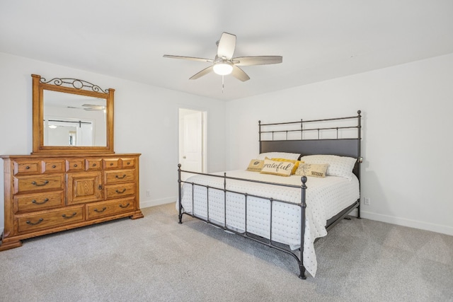 bedroom with light carpet and ceiling fan