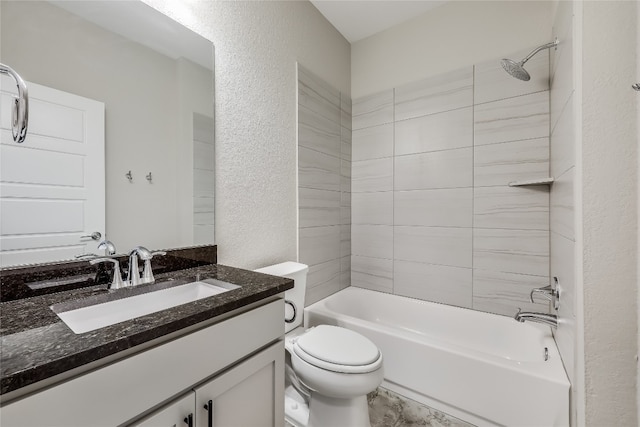 full bathroom featuring vanity, toilet, and tiled shower / bath