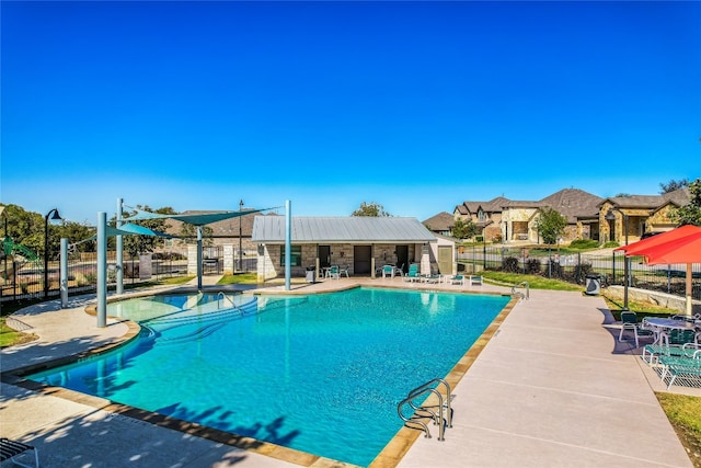 view of swimming pool with a patio area