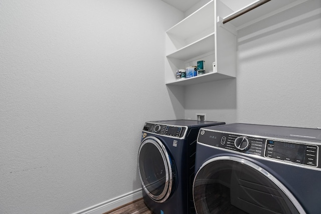 washroom featuring washer and dryer and dark hardwood / wood-style floors