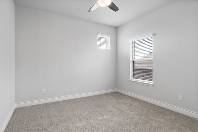 empty room featuring carpet and ceiling fan