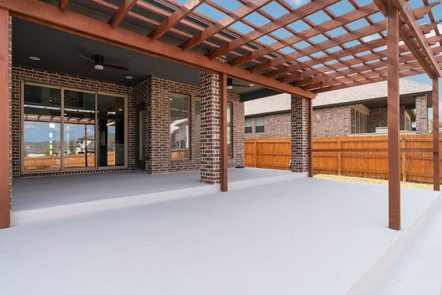 view of patio / terrace featuring a pergola and ceiling fan