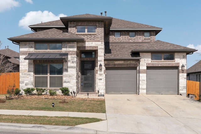 prairie-style home featuring a garage