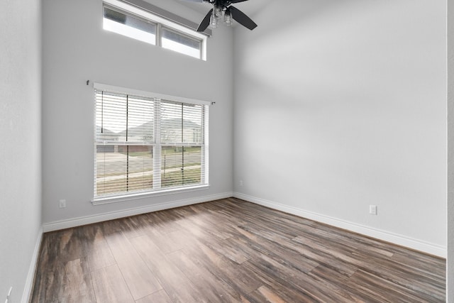 empty room featuring hardwood / wood-style flooring and ceiling fan