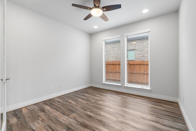 empty room with wood-type flooring and ceiling fan