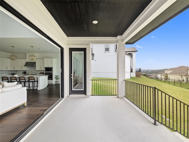 balcony with sink and a porch