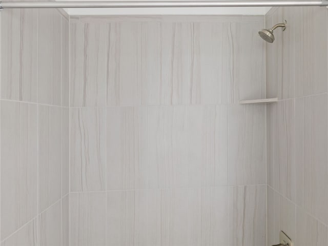 details with a tile shower