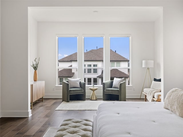 bedroom featuring dark hardwood / wood-style flooring and multiple windows