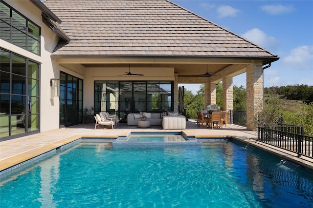 view of pool featuring a patio area, ceiling fan, and an outdoor hangout area