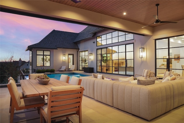 exterior space featuring an outdoor living space and ceiling fan