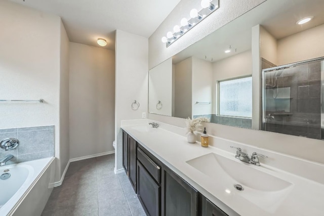 bathroom featuring tile patterned flooring, vanity, and separate shower and tub