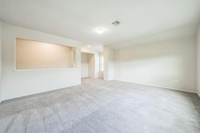 unfurnished room with light colored carpet