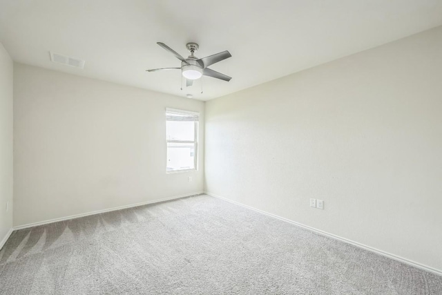 empty room featuring ceiling fan and carpet flooring