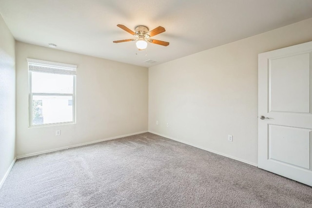 carpeted empty room with ceiling fan