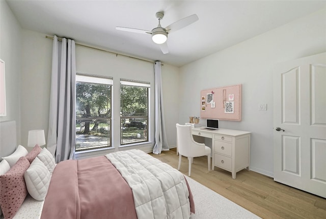 bedroom with ceiling fan and light wood-type flooring