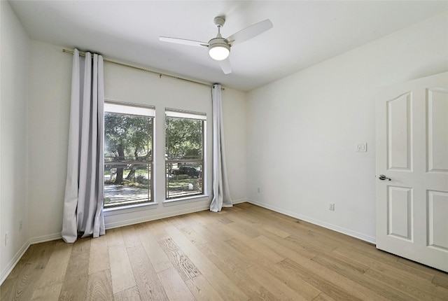 unfurnished room with ceiling fan and light hardwood / wood-style flooring