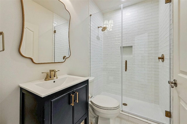 bathroom with vanity, toilet, and an enclosed shower