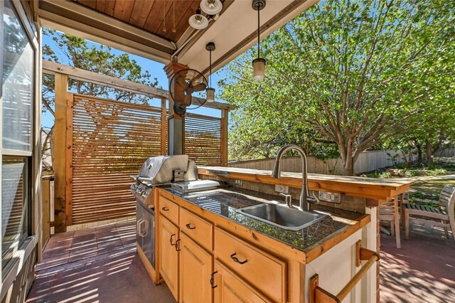 view of patio featuring sink and exterior kitchen