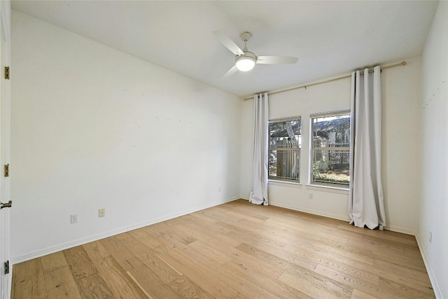 spare room featuring ceiling fan and light hardwood / wood-style flooring