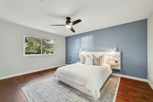 bedroom featuring ceiling fan and dark wood-type flooring