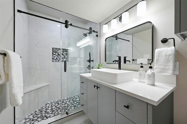 bathroom featuring vanity and an enclosed shower