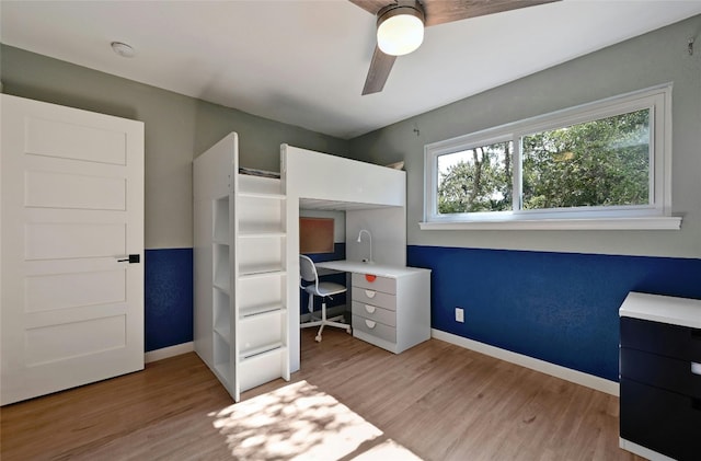 unfurnished bedroom featuring ceiling fan and light hardwood / wood-style floors