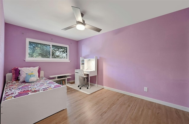 bedroom featuring hardwood / wood-style floors and ceiling fan