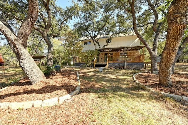 view of yard with covered porch