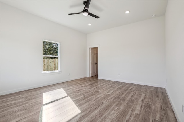 empty room featuring light hardwood / wood-style floors and ceiling fan