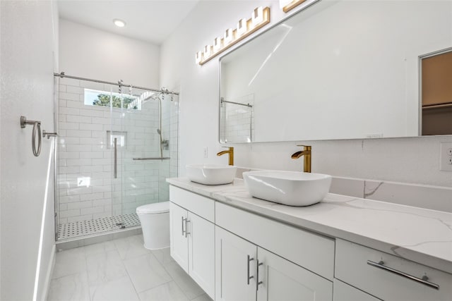 bathroom with vanity, an enclosed shower, and toilet