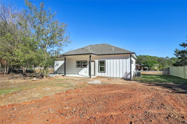 rear view of house featuring a yard and a patio