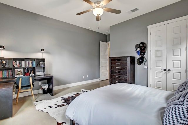 carpeted bedroom with a closet and ceiling fan