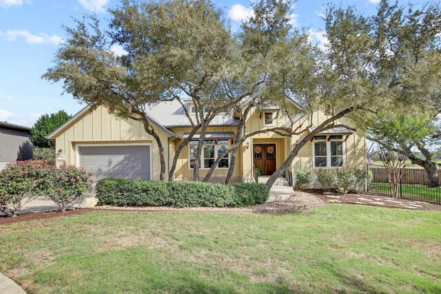 view of front facade with a garage and a front yard