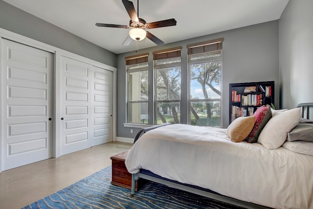 bedroom with concrete flooring and ceiling fan