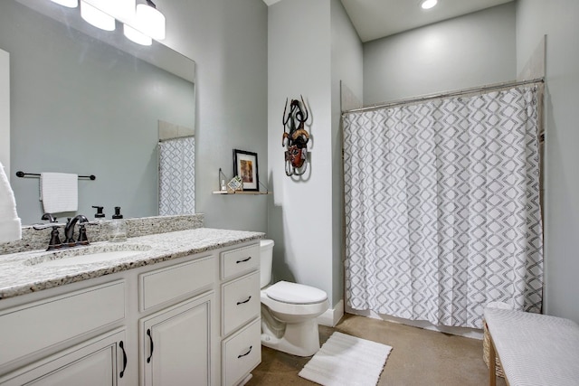 bathroom featuring vanity and toilet