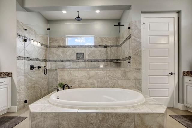 bathroom featuring plus walk in shower and vanity