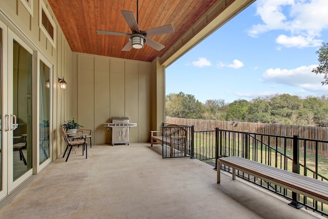 balcony featuring ceiling fan and a grill