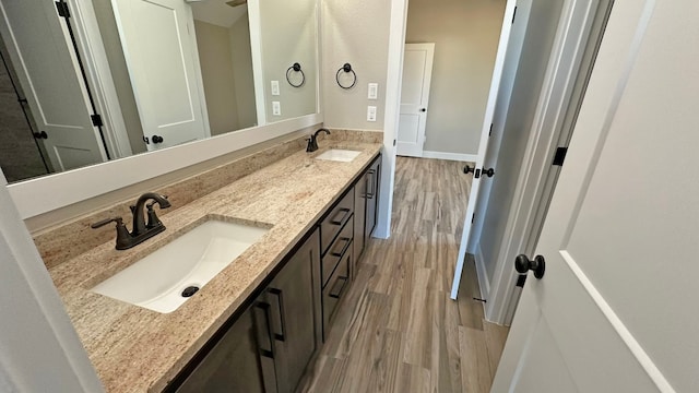 bathroom featuring hardwood / wood-style flooring and vanity