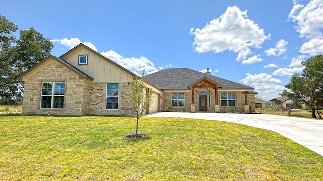 craftsman-style home with a front yard and a garage