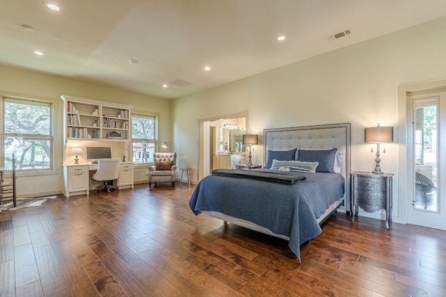 bedroom with dark hardwood / wood-style flooring