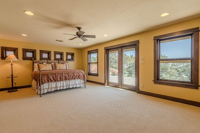 carpeted bedroom featuring access to exterior and ceiling fan