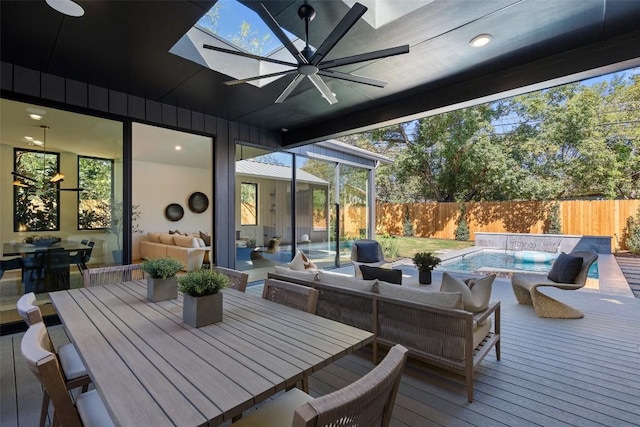 2606 Cavileer Ave, Austin, TX 78757 - deck featuring ceiling fan, a fenced backyard, an outdoor hangout area, and a hot tub