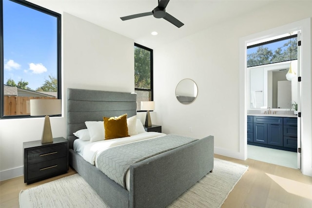 2606 Cavileer Ave, Austin, TX 78757 - bedroom featuring light wood-style flooring, ensuite bath, recessed lighting, and ceiling fan