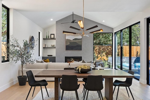 2606 Cavileer Ave, Austin, TX 78757 - dining space featuring vaulted ceiling, ceiling fan, baseboards, light wood finished floors, and healthy amount of natural light
