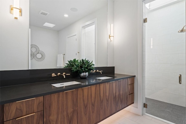 2606 Cavileer Ave, Austin, TX 78757 - bathroom featuring double vanity, a shower stall, and tile patterned flooring