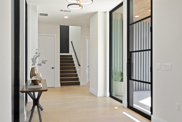 2606 Cavileer Ave, Austin, TX 78757 - foyer entrance featuring light wood finished floors and stairs