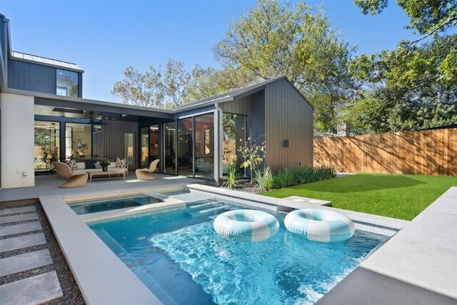 2606 Cavileer Ave, Austin, TX 78757 - back of house with a ceiling fan, outdoor lounge area, an in-ground hot tub, and a patio