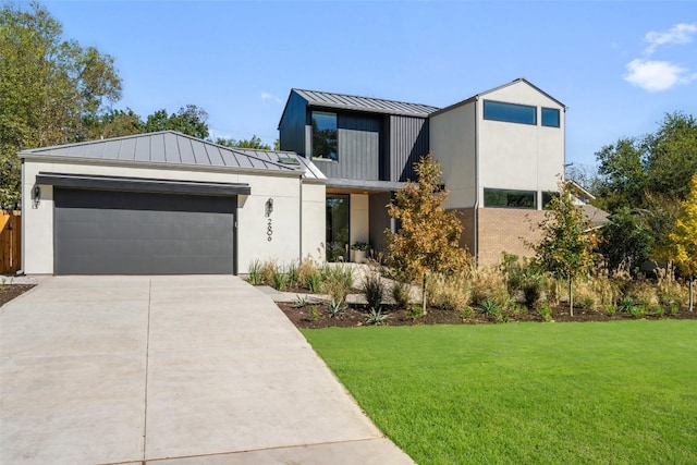 2606 Cavileer Ave, Austin, TX 78757 - contemporary home with a standing seam roof, a metal roof, a front lawn, concrete driveway, and an attached garage